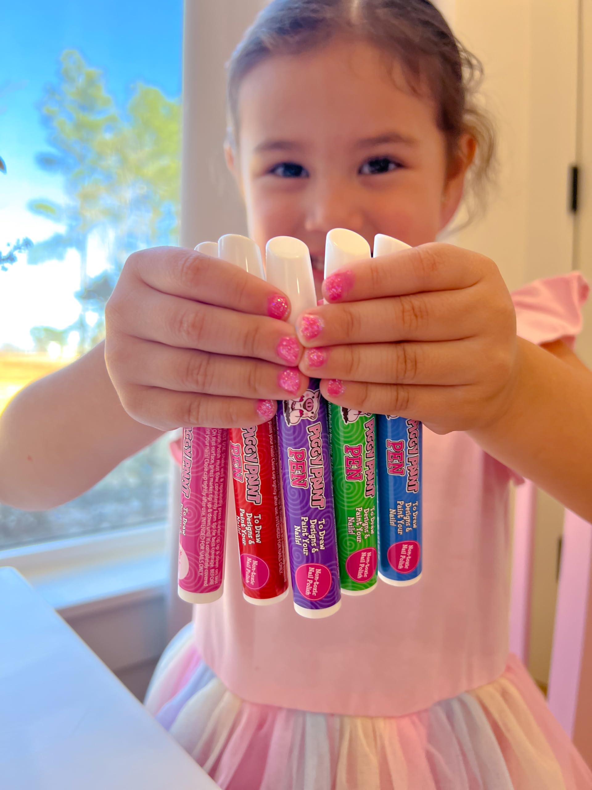 Piggy Paint kid hands with painted nails showcasing fun results and parent-approved safety