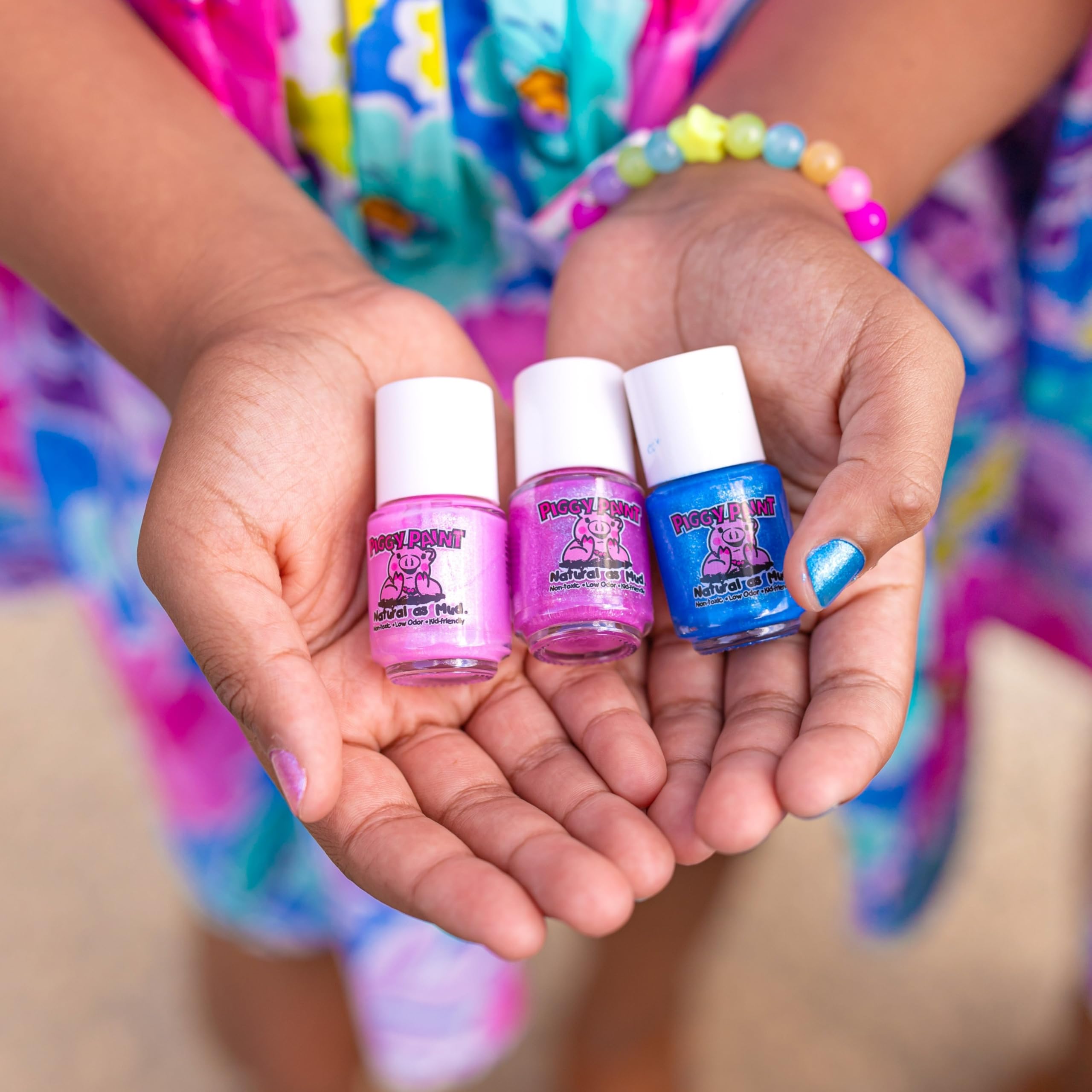 Piggy Paint kids having manicure, demonstrating easy at-home use