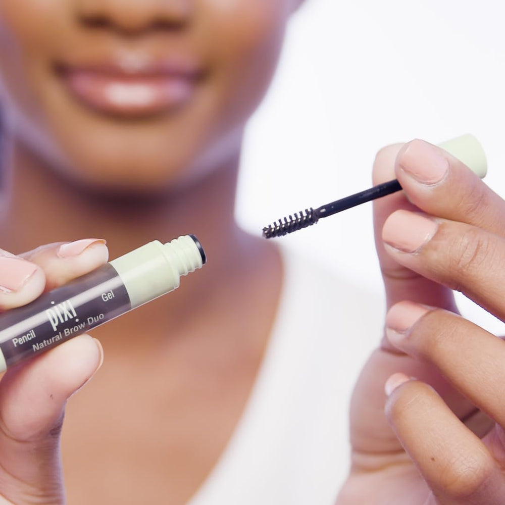 Pixi Brow Duo held in hand to show compact size and travel-friendly convenience