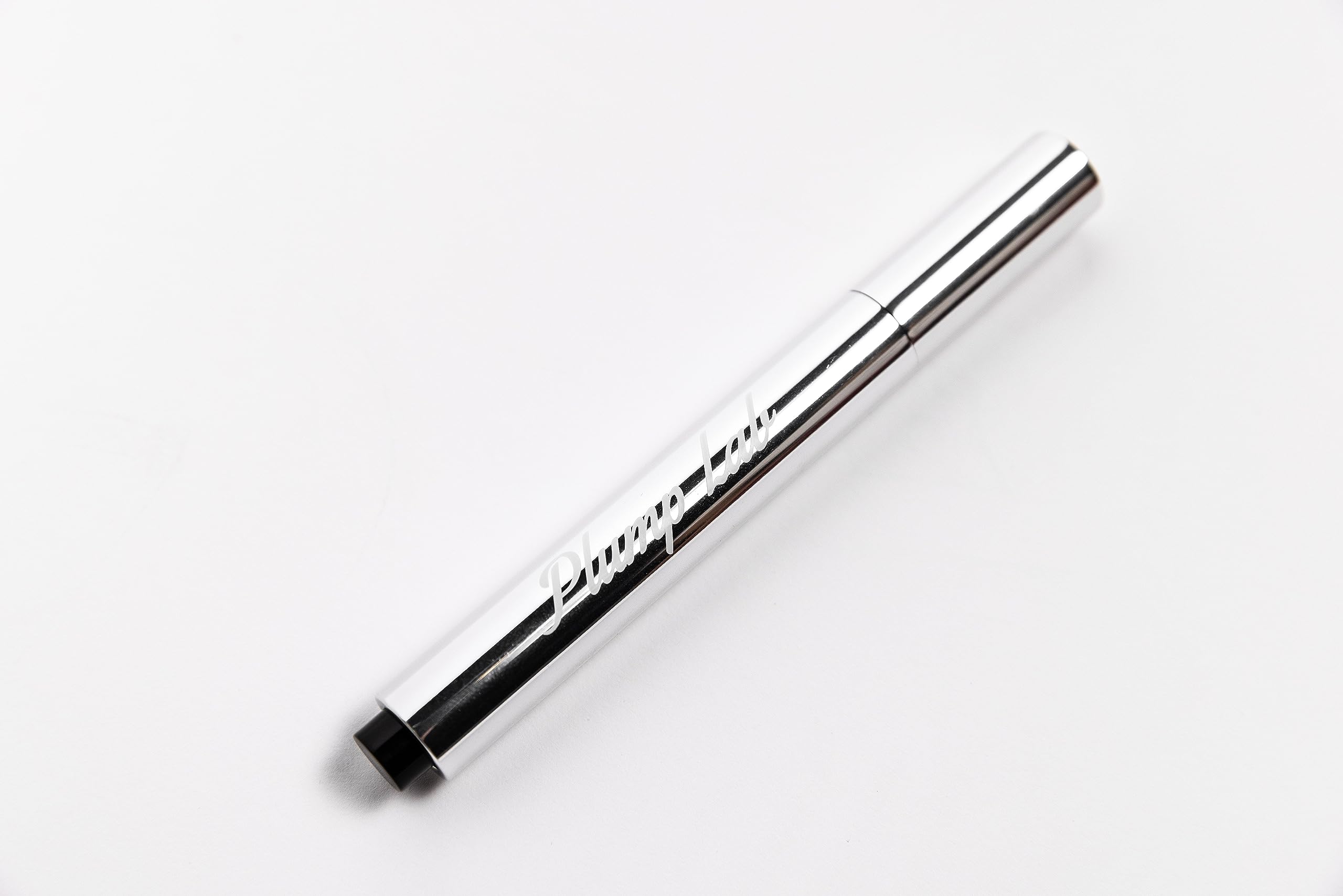 Plump Lab gloss texture closeup highlighting smooth sheen and hydration