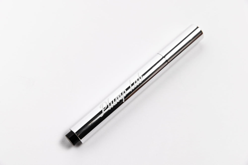 Plump Lab gloss texture closeup highlighting smooth sheen and hydration