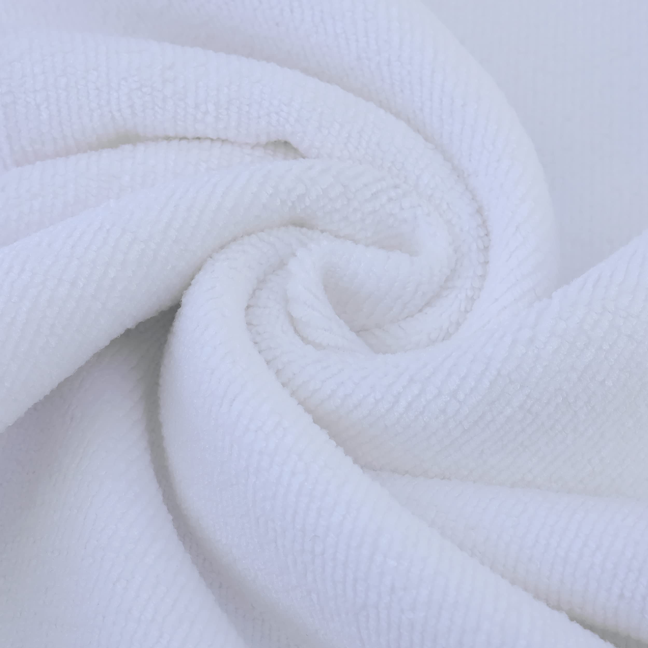POLYTE towel next to ruler showing 20x40 inch size for full hair coverage