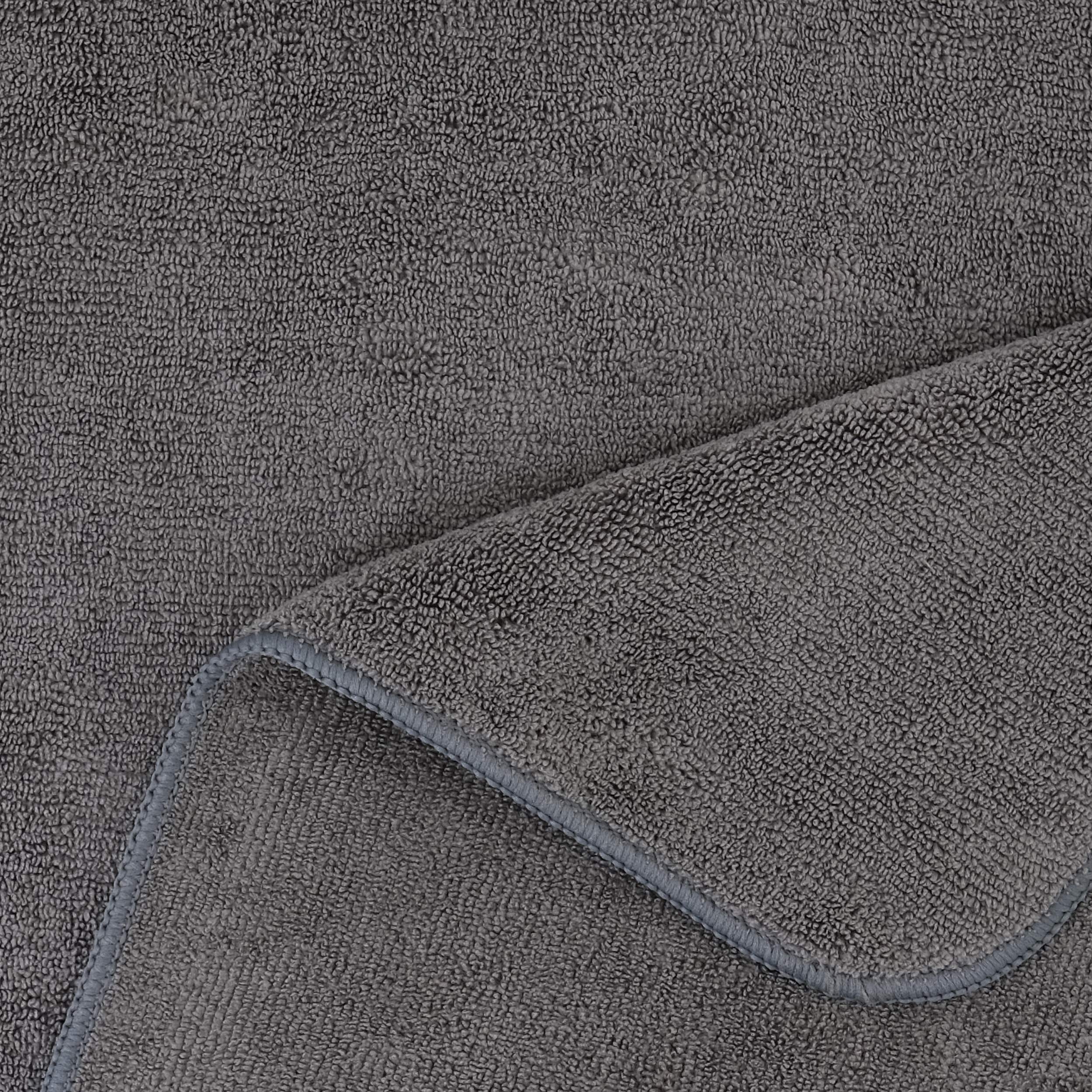 POLYTE towel beside ruler demonstrating 20x40 inch coverage benefit