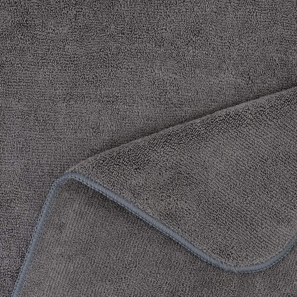 POLYTE towel beside ruler demonstrating 20x40 inch coverage benefit