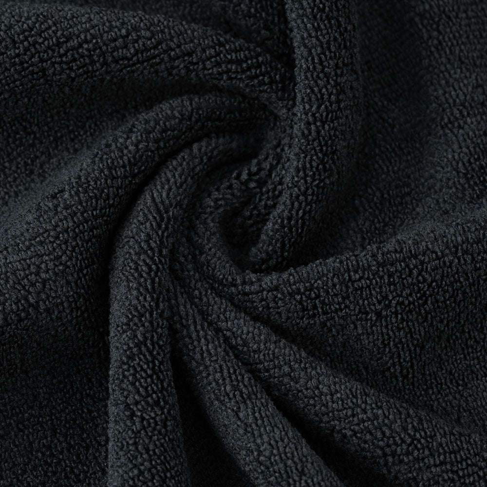 POLYTE towel wrapped around hair demonstrating gentle drying and reduced frizz