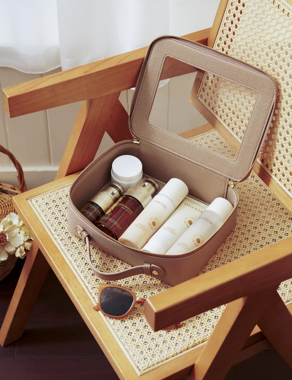 Popvibe open bag packed with skincare and makeup for travel