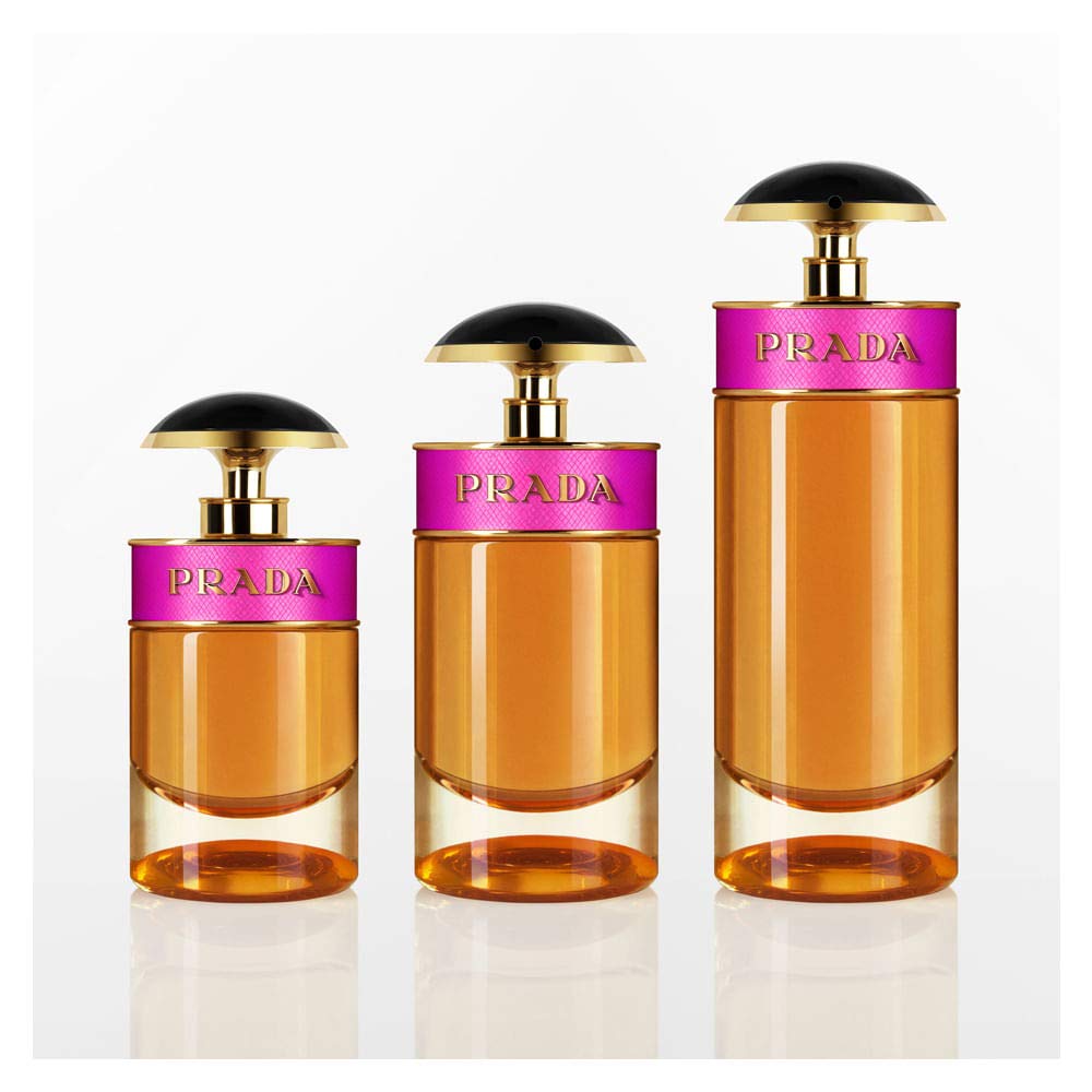 Woman spritzing Prada Candy showing application and quick scent refresh benefit