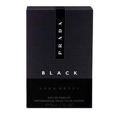 Prada Luna Rossa Black bottle held in hand demonstrating travel size convenience