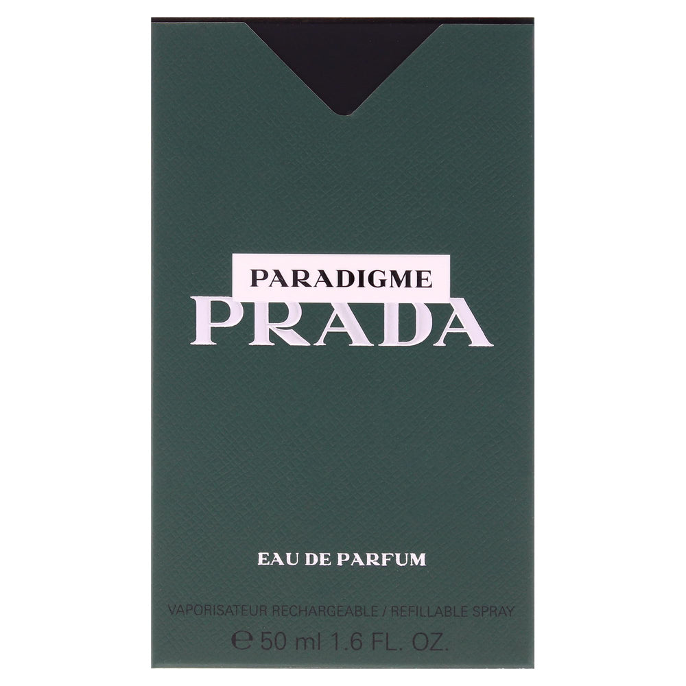 Hand spraying Prada Paradigme illustrating controlled application and confidence boost