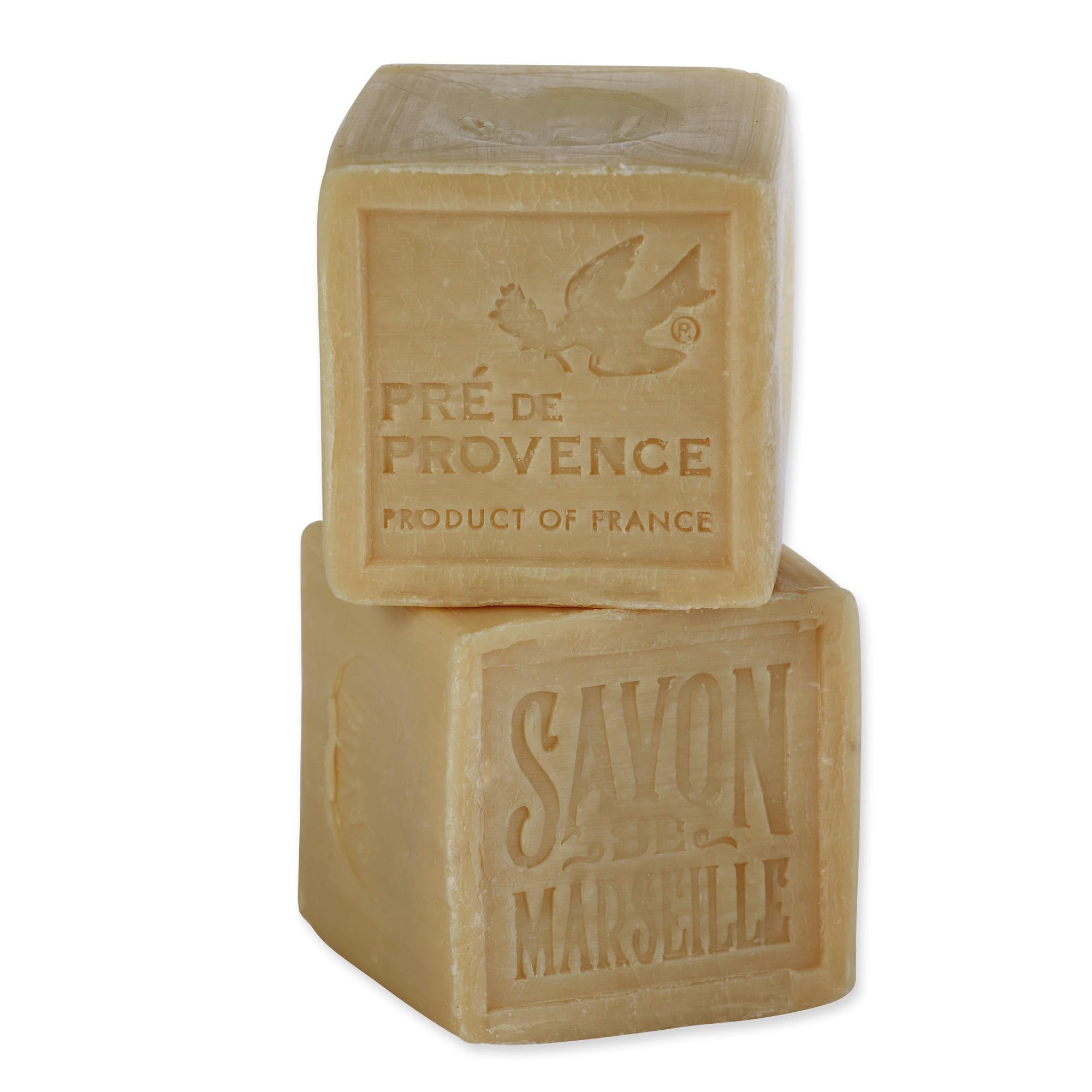 Pre de Provence soap shavings beside laundry illustrating stain-fighting flakes benefit