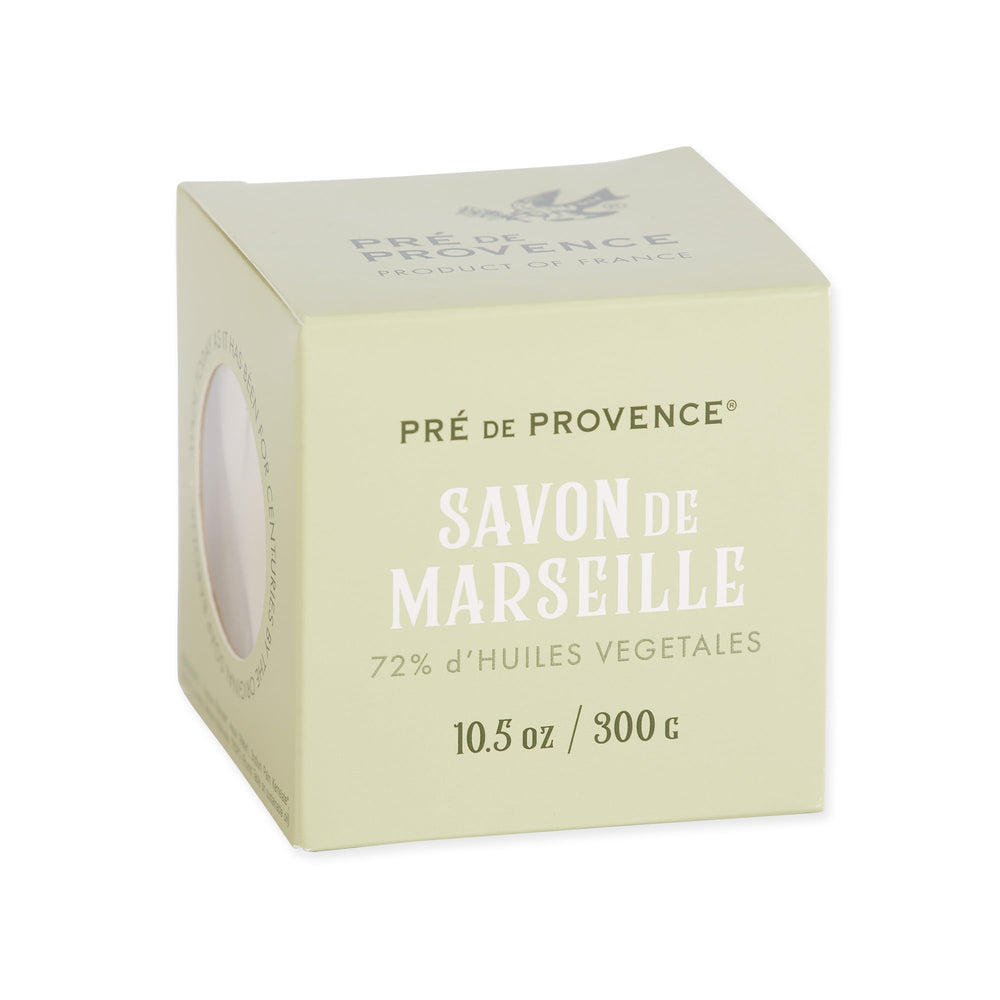 Pre de Provence soap at kitchen sink cleaning dishes demonstrating grease-cutting benefit