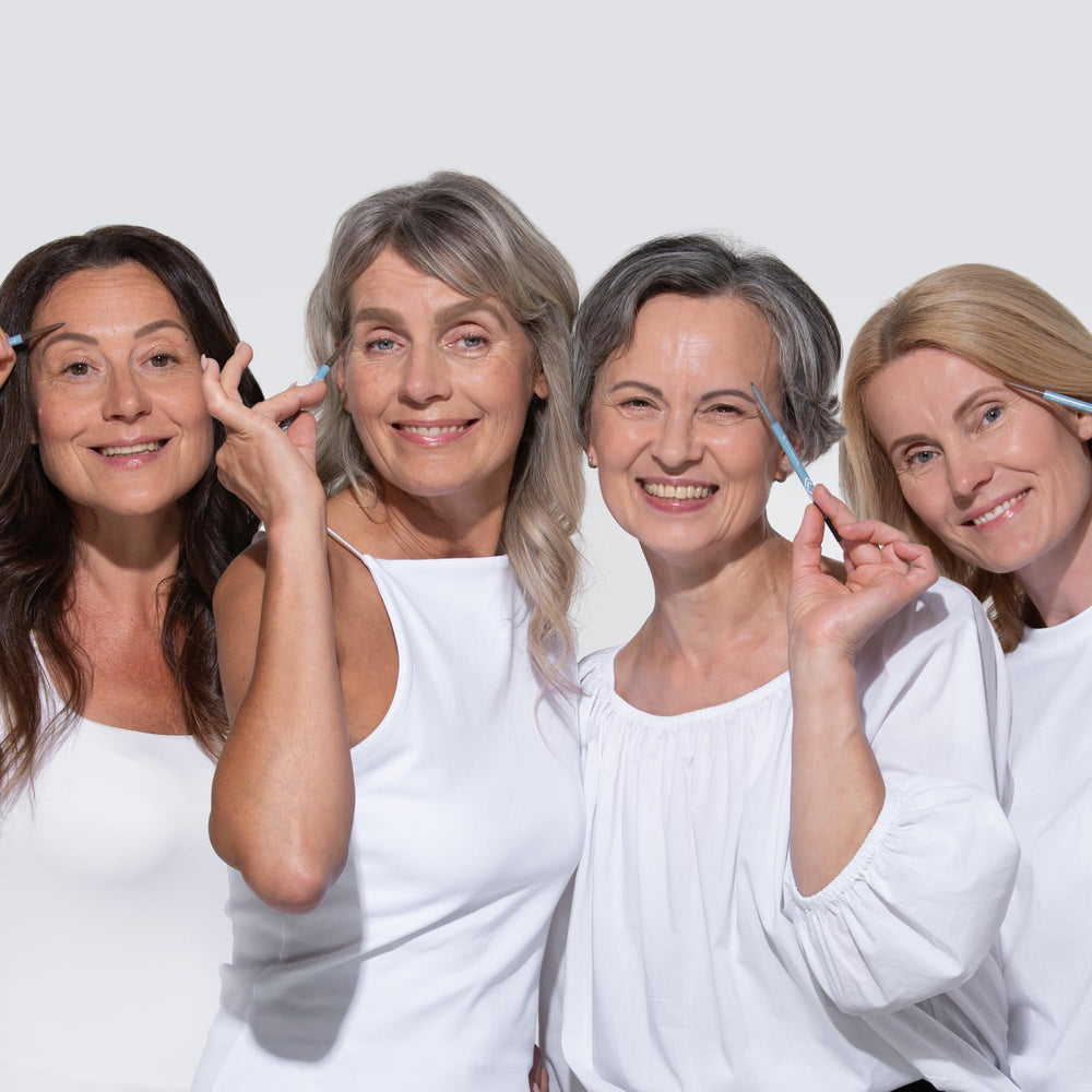 Prime Prometics lifestyle shot of mature woman applying pencil for confidence