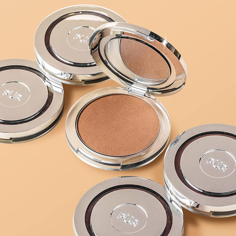 PÜR MINERALS bronzer brush applying to cheek showing easy blend benefit