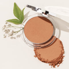 PÜR MINERALS bronzer swatch on arm showing buildable golden glow benefit