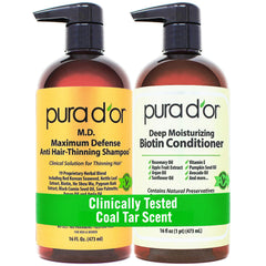PURA D'OR front packaging of the biotin shampoo and conditioner set showing benefits