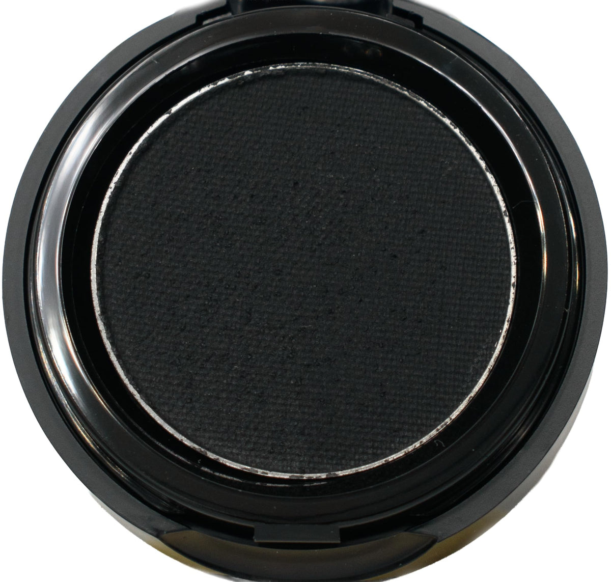 Pure Ziva compact front view showing sleek packaging and matte black cake for portability