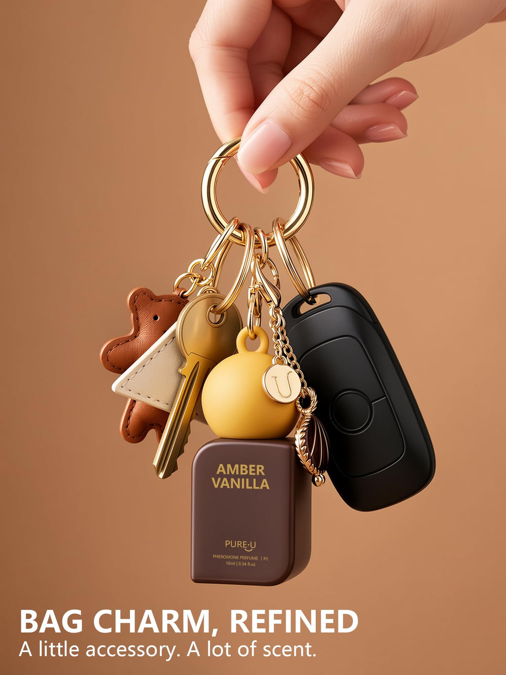 PUREU keychain clip attached to bag for on-the-go reapplication benefit