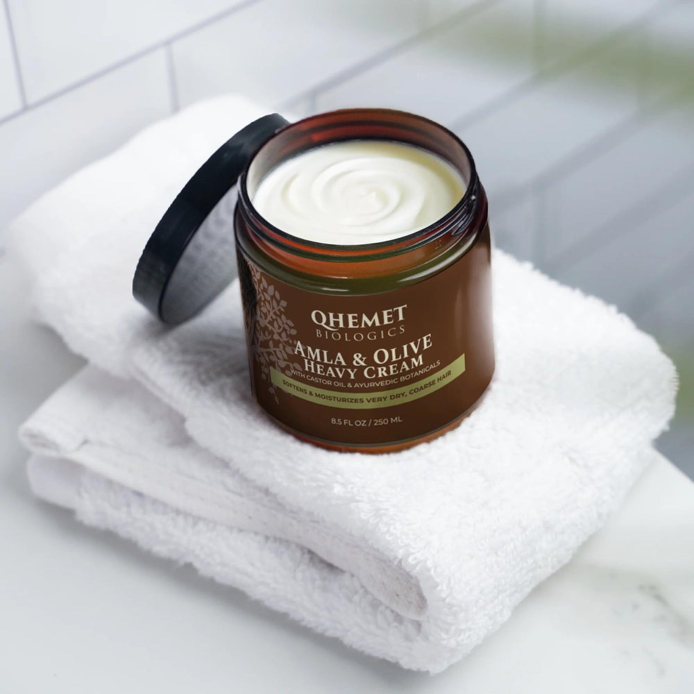 Qhemet Biologics cream texture close-up showing rich moisturizing feel