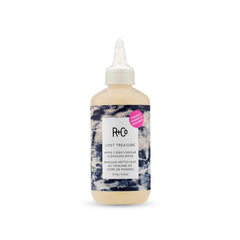 R+Co bottle front view showing label and compact 6 oz size for travel convenience