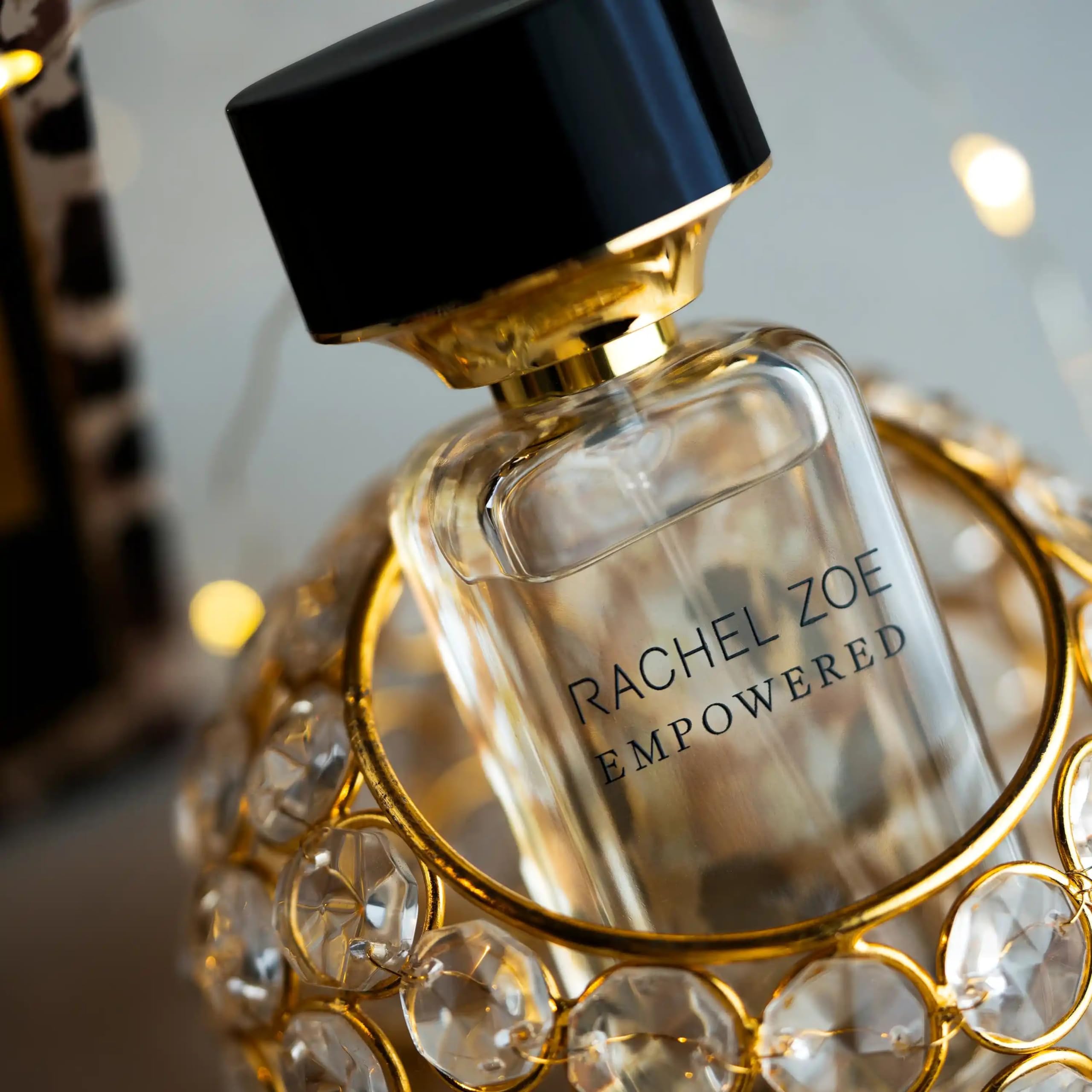 Rachel Zoe bottle on vanity in lifestyle scene evoking polished style