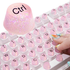 Raised Button front packaging showing glitter silicone keycaps and benefits