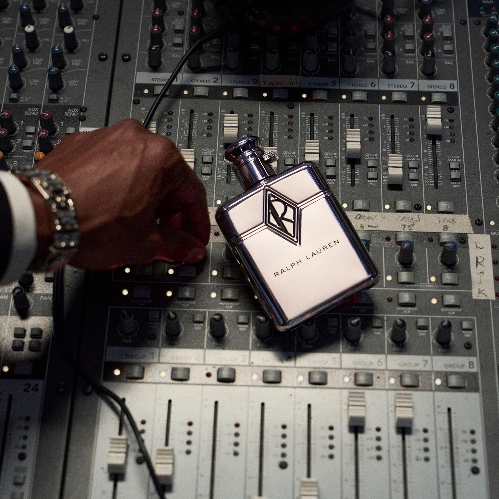 RALPH LAUREN FRAGRANCES bottle on table in evening setting benefit: suits nights out