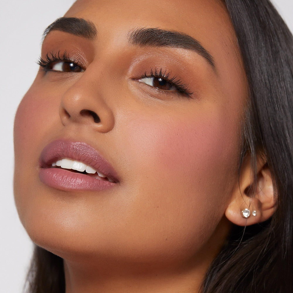Rare Beauty closeup on model cheek showing natural, flattering pink flush result