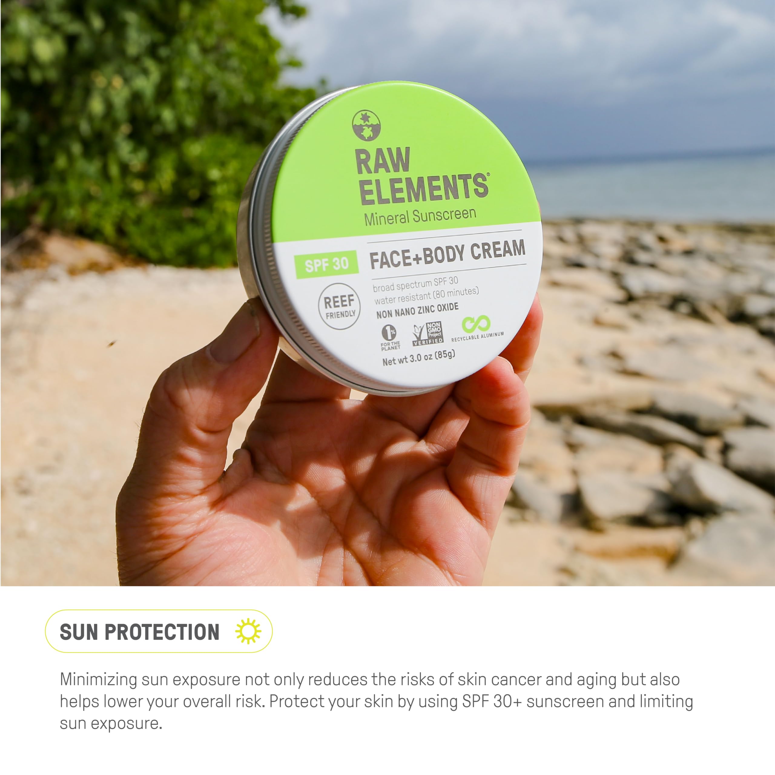 Raw Elements sunscreen on beach towel showing reef-safe use during seaside activities