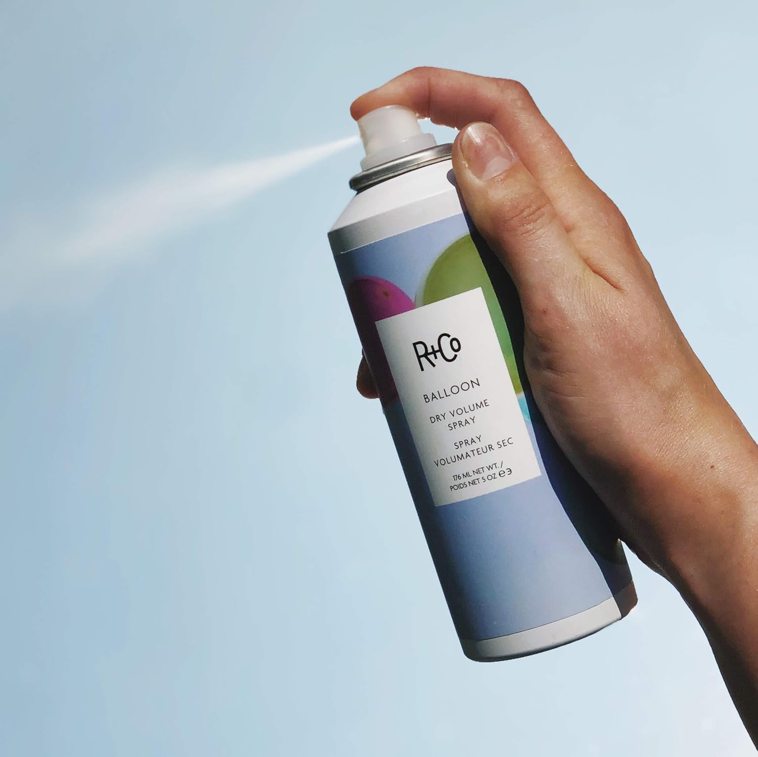 R+Co BALLOON size comparison next to hand to show the 5.0 oz scale