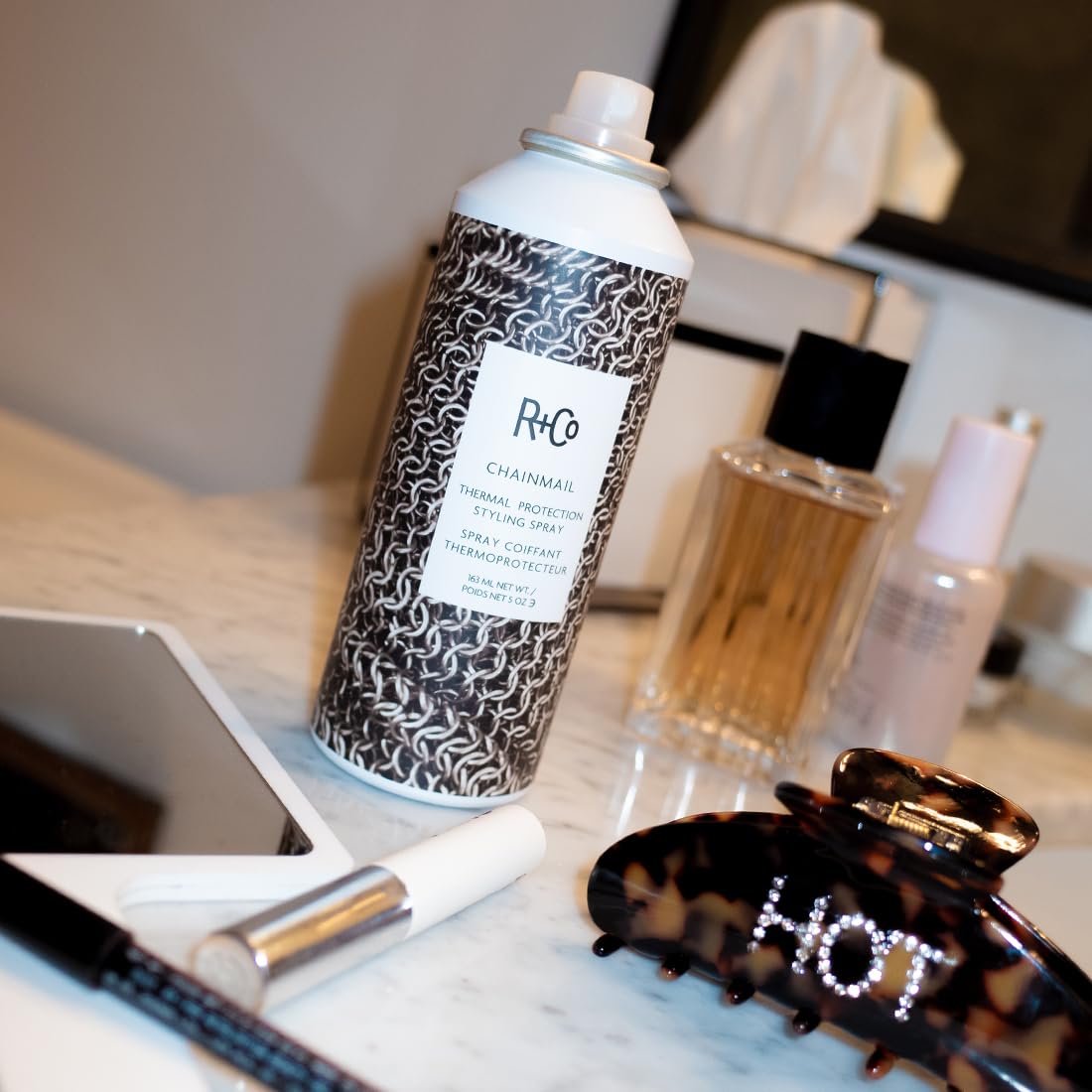R+Co CHAINMAIL ingredients label close-up highlighting botanical extracts and polymers benefit