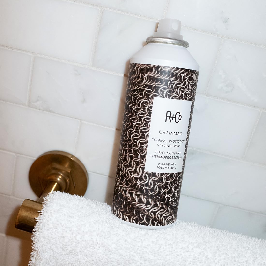 R+Co CHAINMAIL on bathroom vanity next to tools, integrates into everyday styling routine benefit