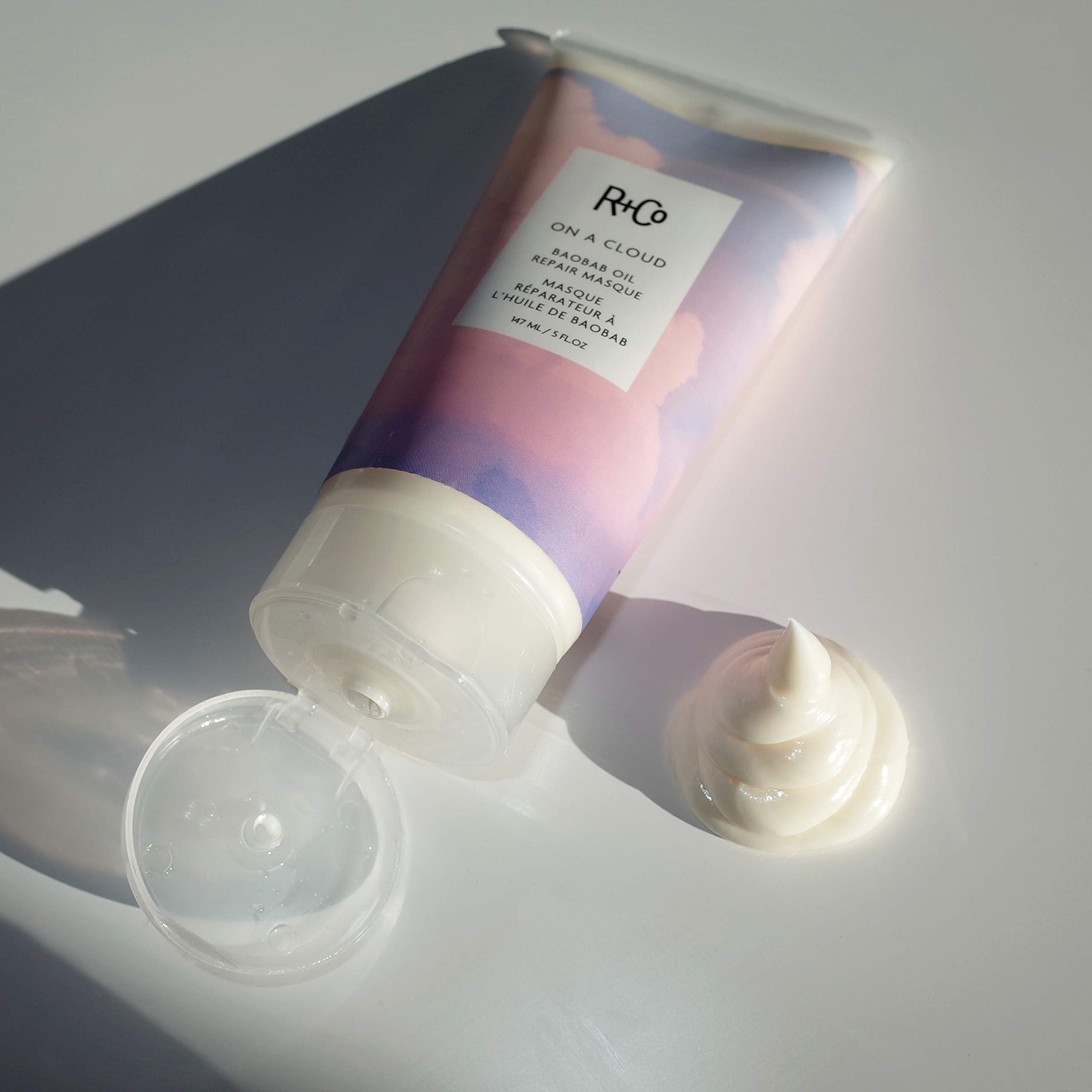 R+Co jar on bathroom shelf styled for a calm self-care routine benefit