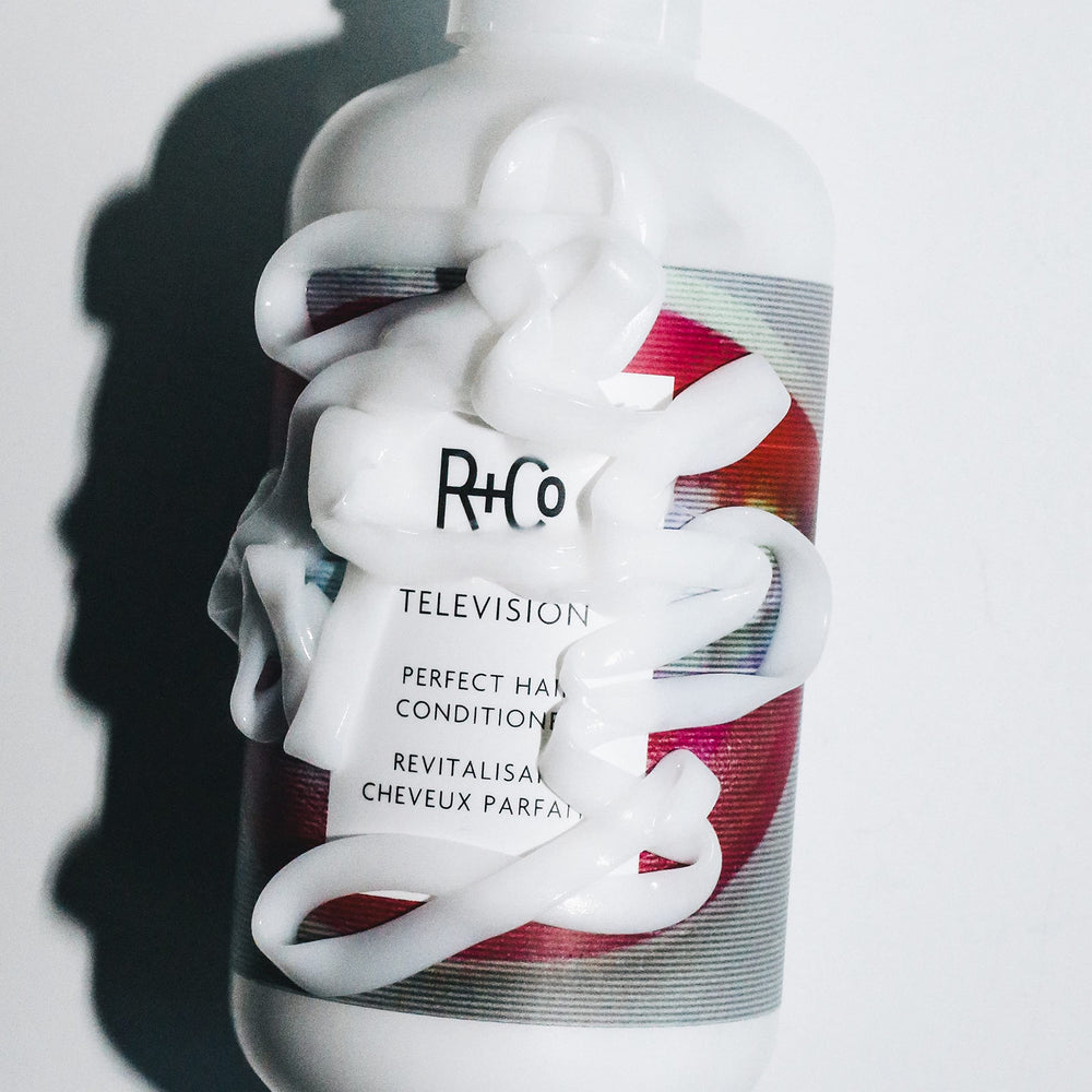 R+Co TELEVISION conditioner in bathroom lifestyle for ready-to-style hair benefit