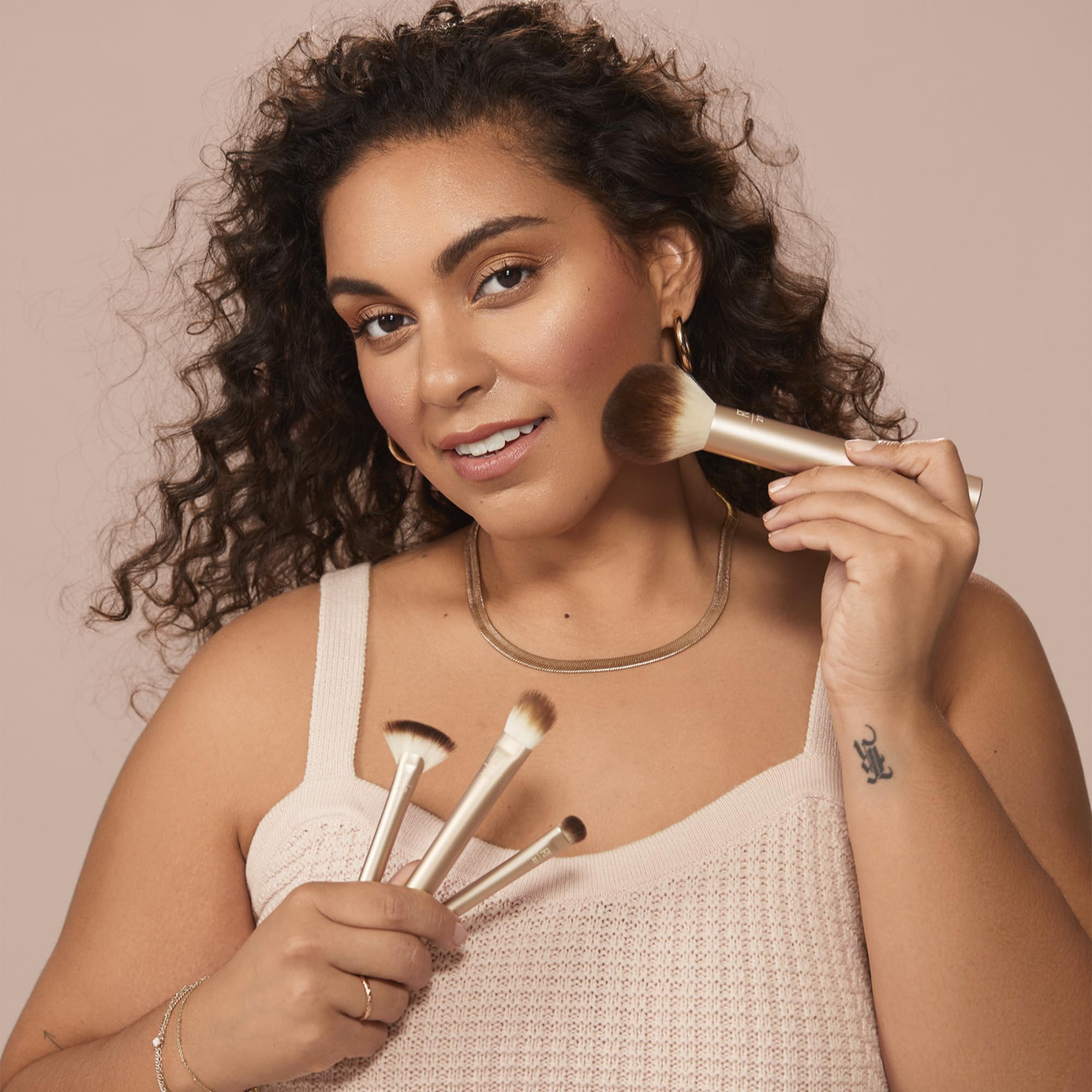 Real Techniques applying foundation on cheek for smooth natural finish