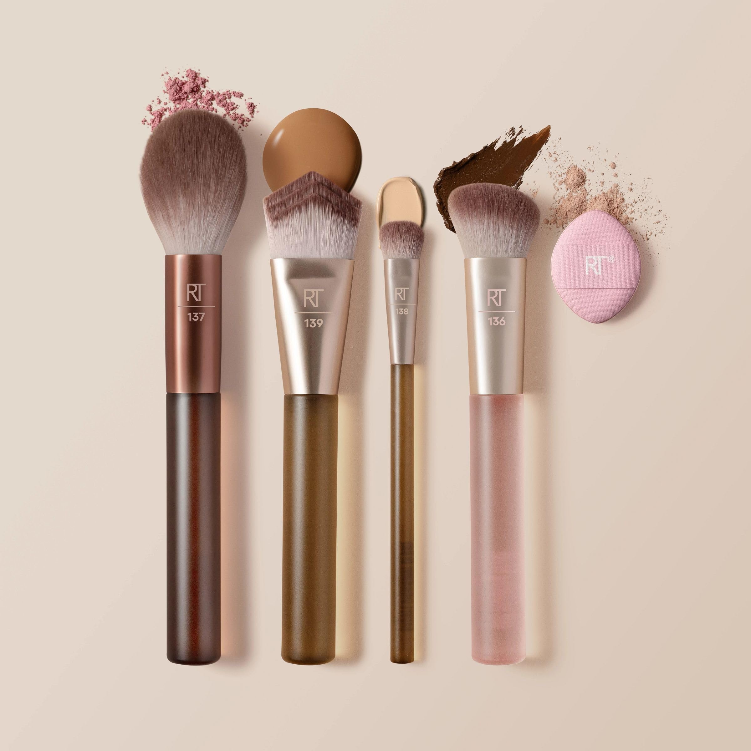 Real Techniques brushes inside a compact makeup bag, travel-ready base tools