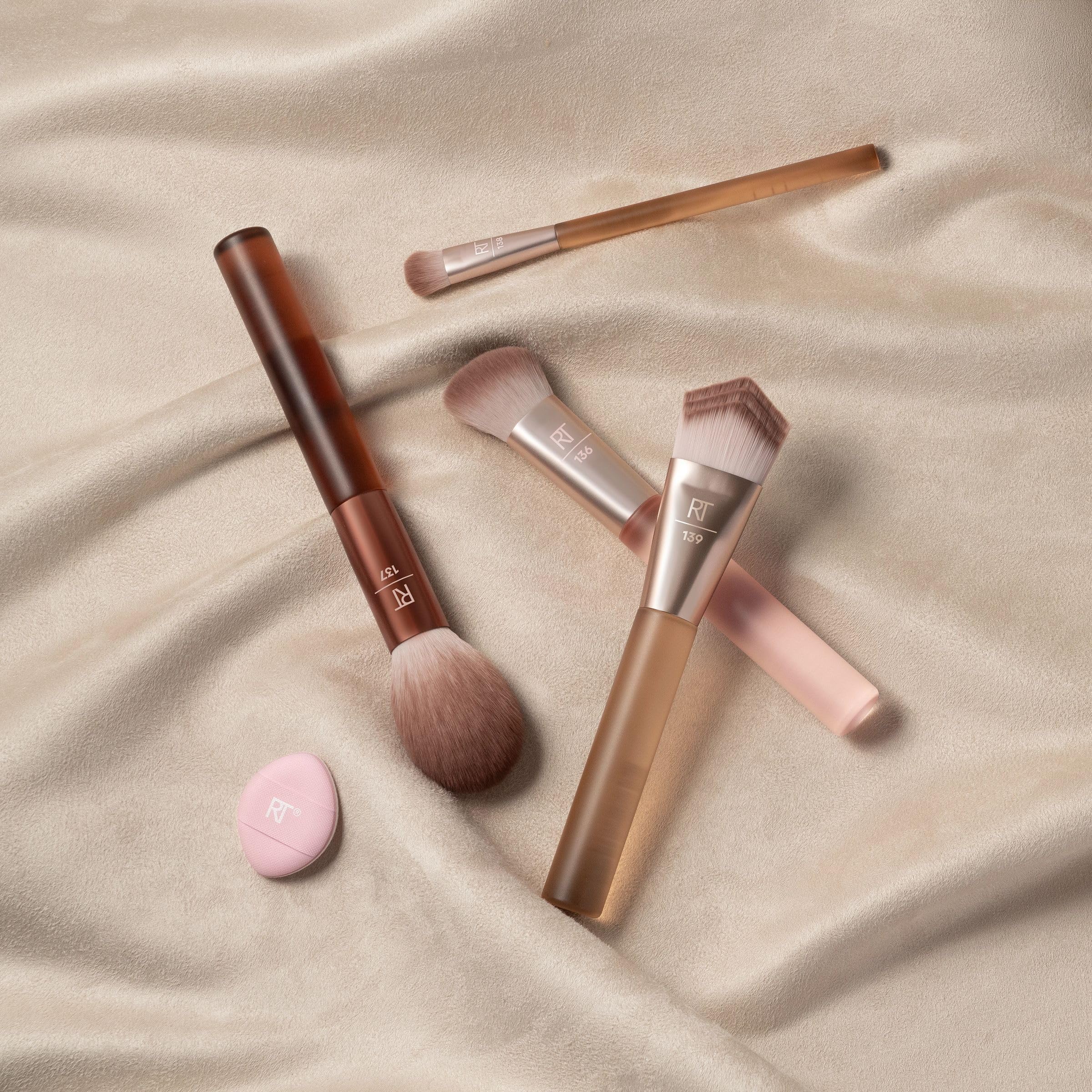 Real Techniques Mini Miracle Powder Puff shown in hand, sets under-eye makeup cleanly