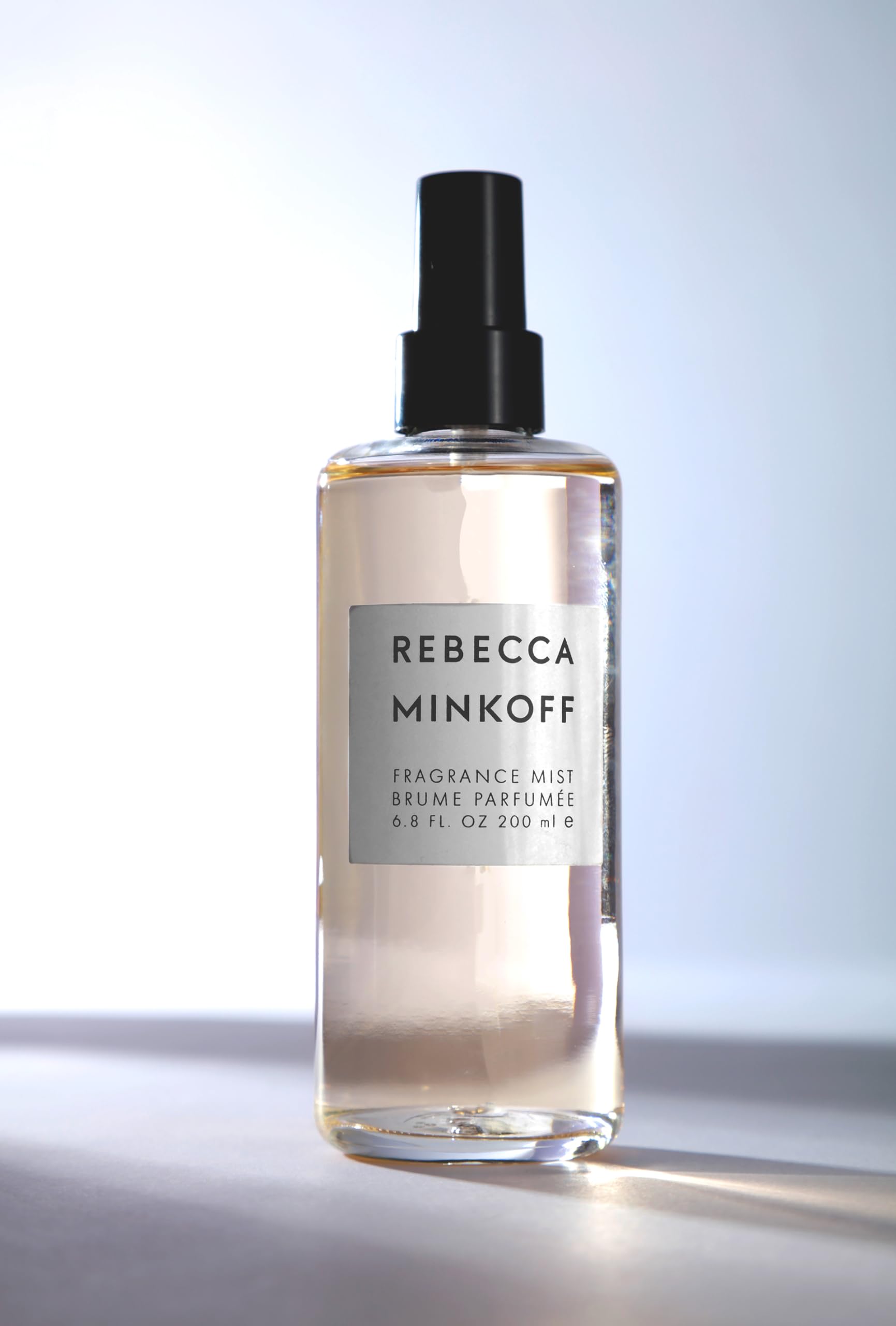 Rebecca Minkoff droplet on skin demonstrating lightweight texture and quick absorption benefit