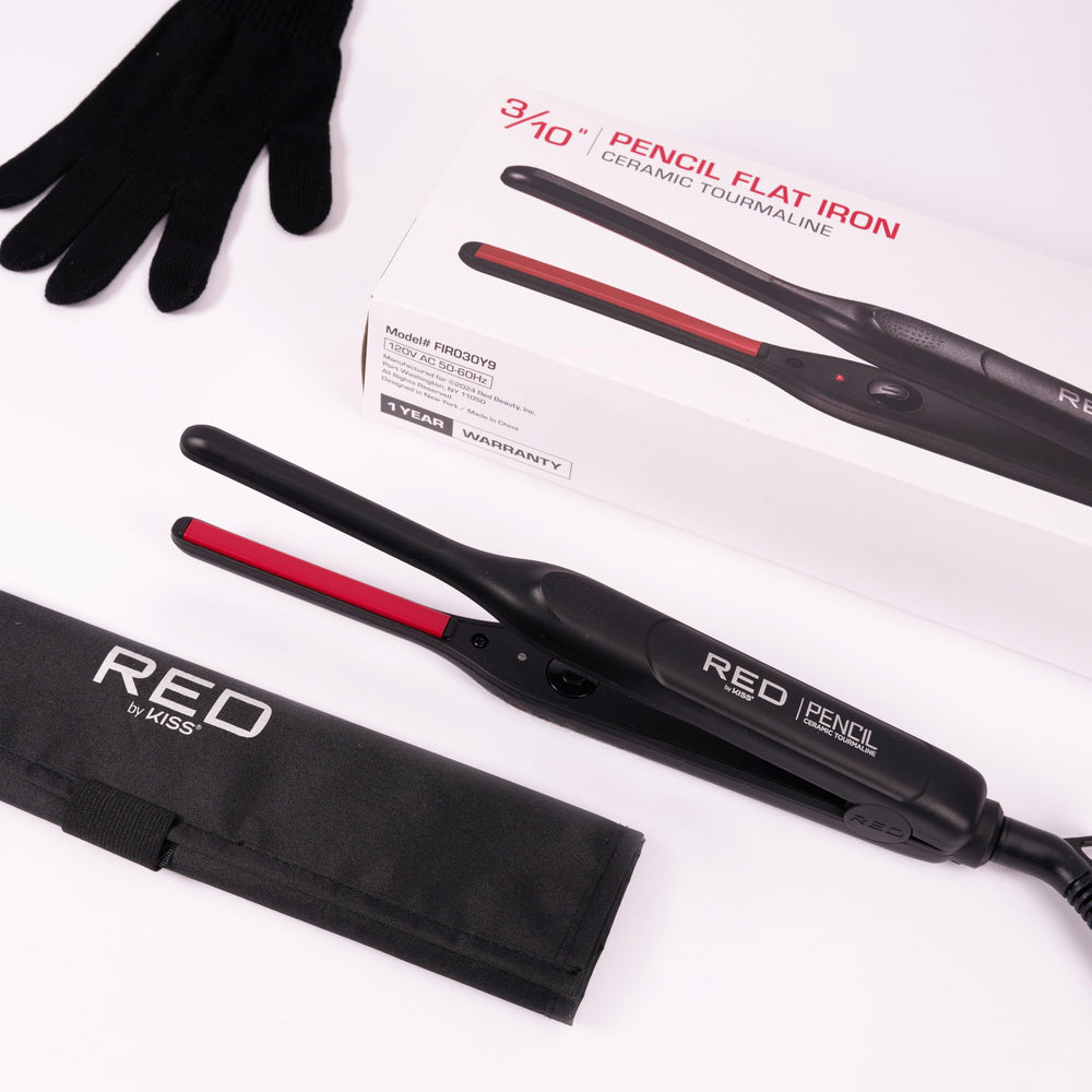 Red by Kiss held in hand to show compact size for travel and storage
