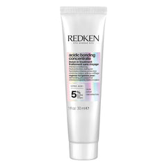 Redken bottle front packaging showing product and benefit of repair
