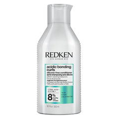 Redken bottle front packaging showing product identity and benefits