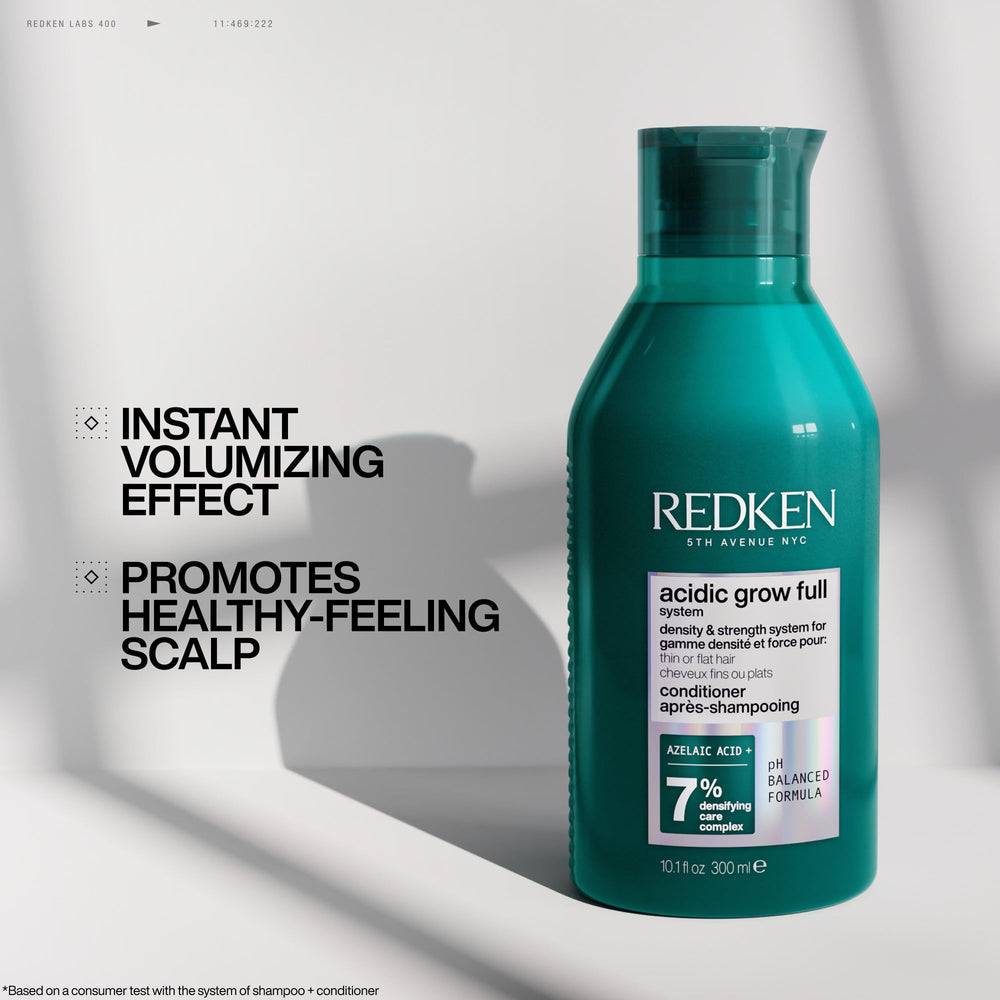 Redken conditioner displayed with matching serum and spray illustrating system use