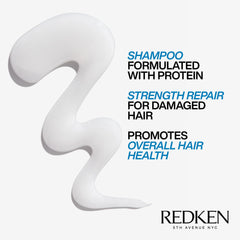 Redken Extreme bottle in hand for scale to show 10.1 fl oz practical size