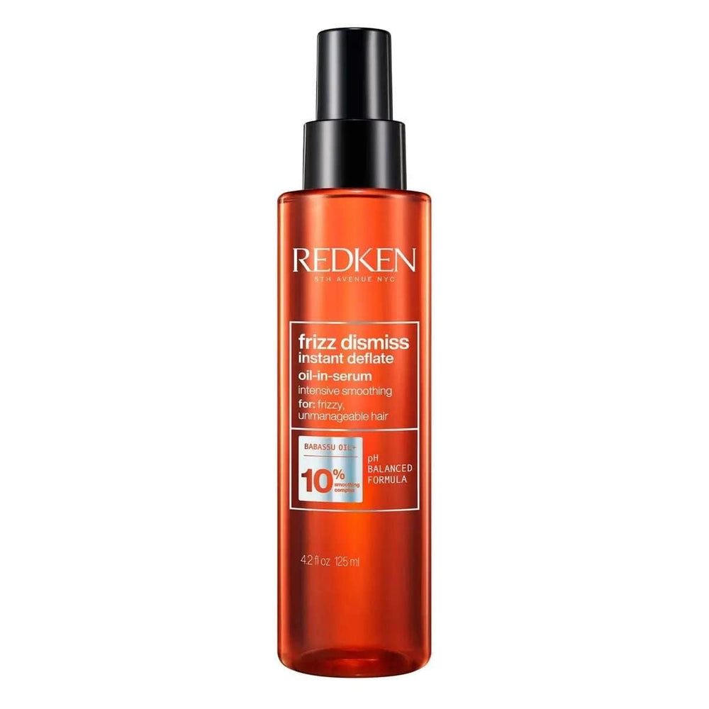 Redken bottle front view showing product branding and benefit for frizz control