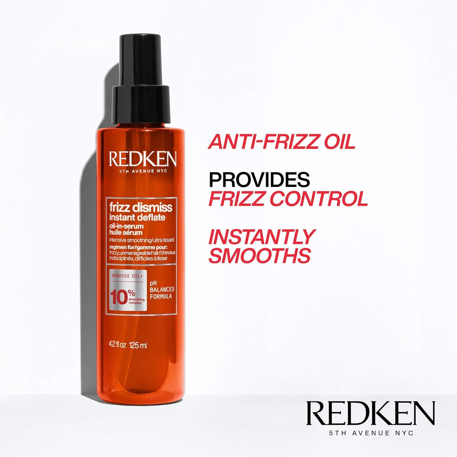 Hand applying Redken serum to hair demonstrating easy control and reduced frizz