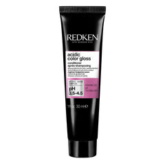 Redken front bottle showing product and compact size for travel