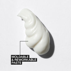Redken paste being rubbed between hands demonstrating even application and control