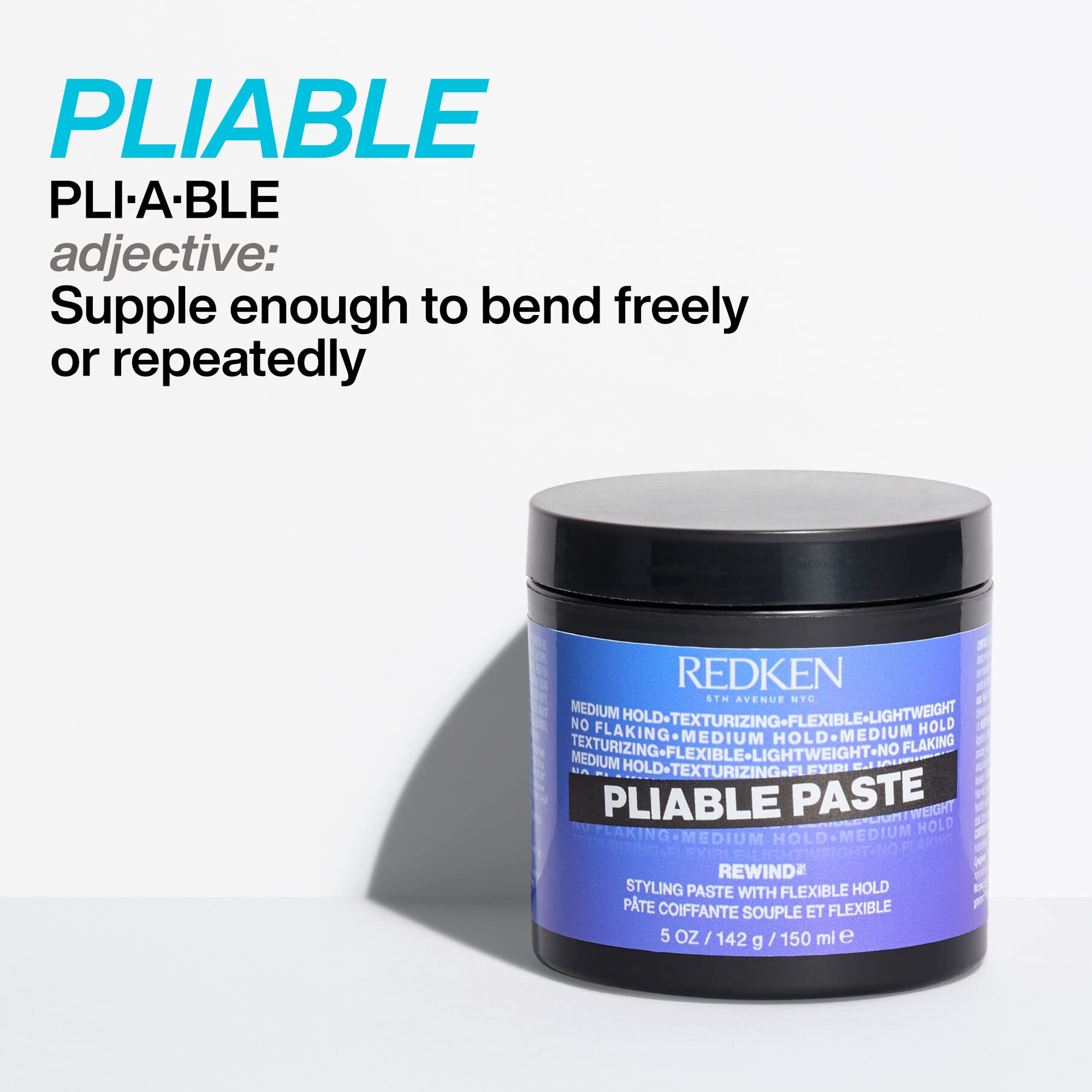 Redken jar next to a measuring tape showing compact travel-friendly size