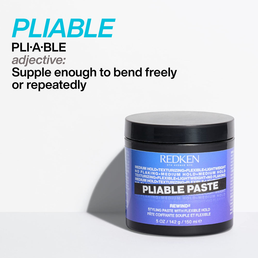 Redken jar next to a measuring tape showing compact travel-friendly size