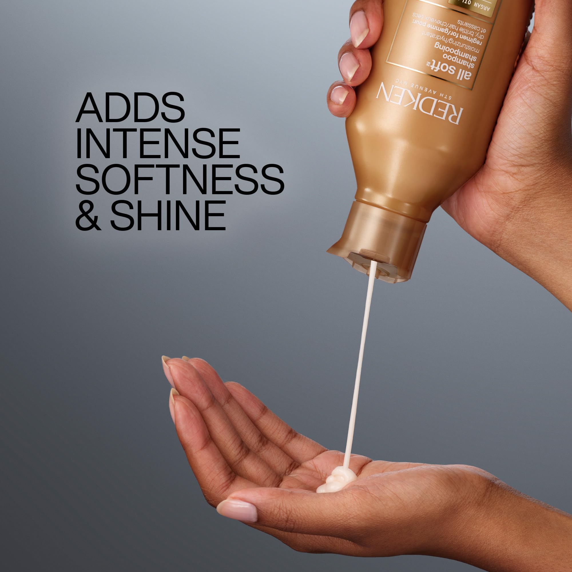 Travel-size Redken All Soft bottle next to coin for compact convenience