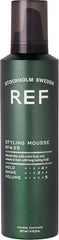 REF mousse in hand being applied to hair for effortless root lift and styling control